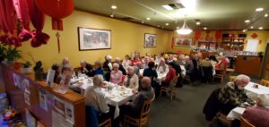 View of Sirs enjoying Chinese food